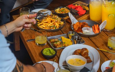 A restaurant with a table full of amazing food